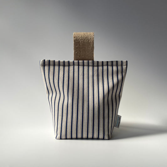 Blue and white stripe on natural background fabric doorstop with jute handle.