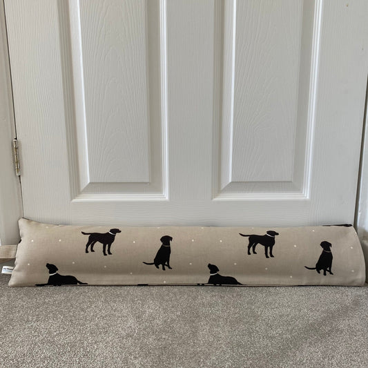 Black Lab dog patterned beige, white and black heavy draught excluder with washable cover and hanging loop.
