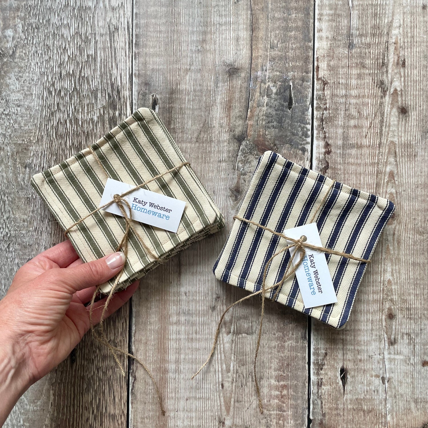 Olive Green and Navy ticking stripe fabric drinks coasters presented in a 6 pack tied with twine and a Katy Webster Homeware tag.