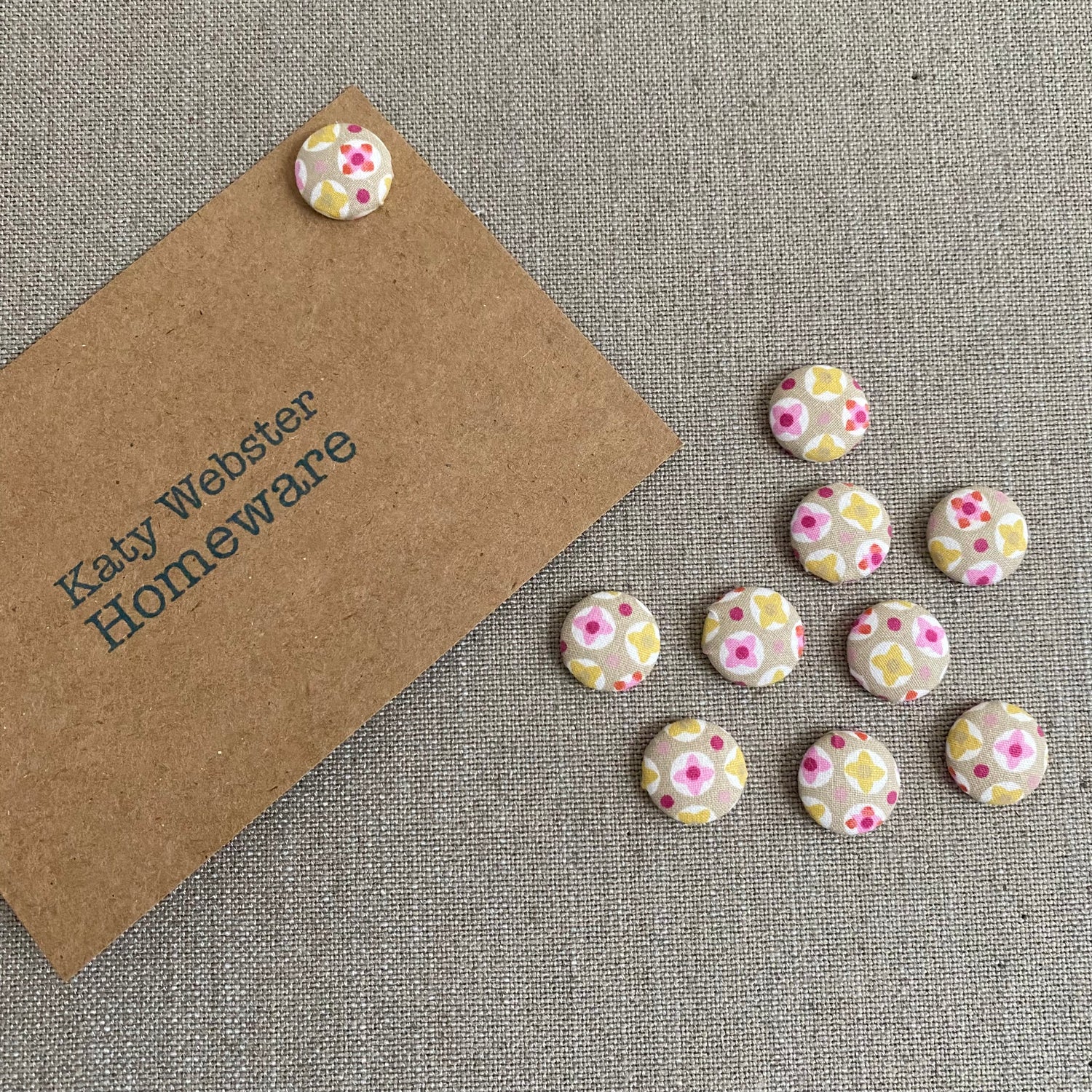Geometric taupe and pink fabric covered drawing pins