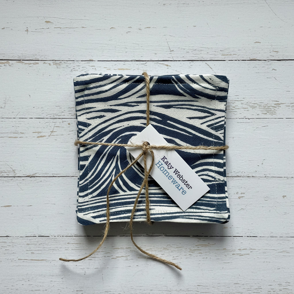 Navy sea surf print coasters tied with twine.