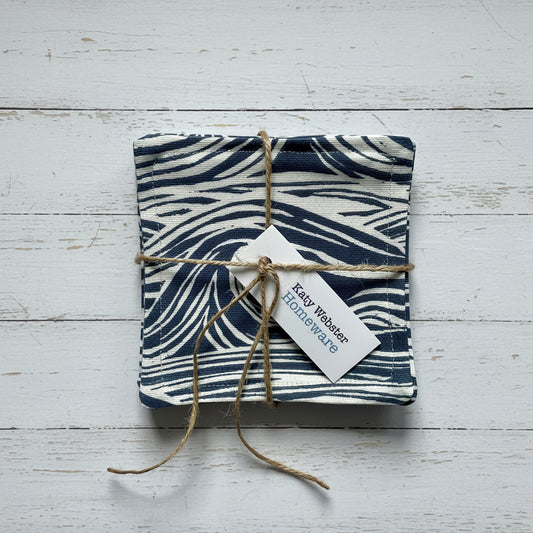 Navy sea surf print coasters tied with twine.