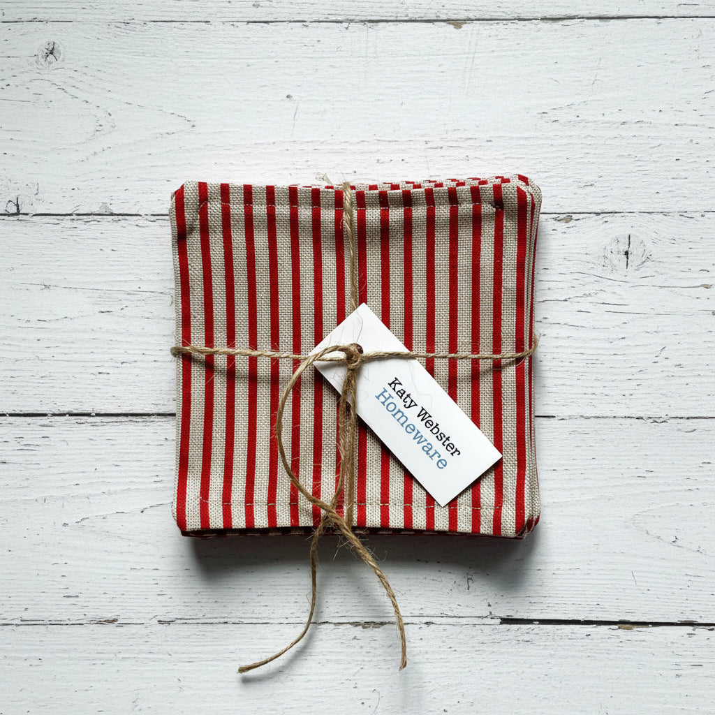 Red and beige striped fabric coasters tied with twine.