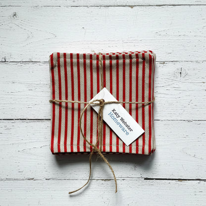 Red and beige striped fabric coasters tied with twine.