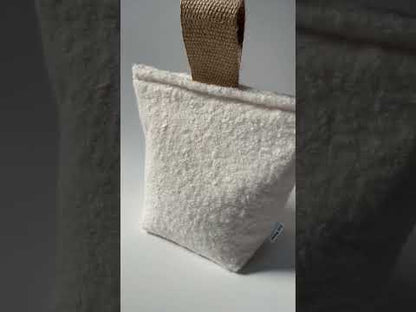 Heavy ivory boucle doorstop with jute handle.